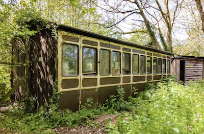Converted railway station and carriage for sale